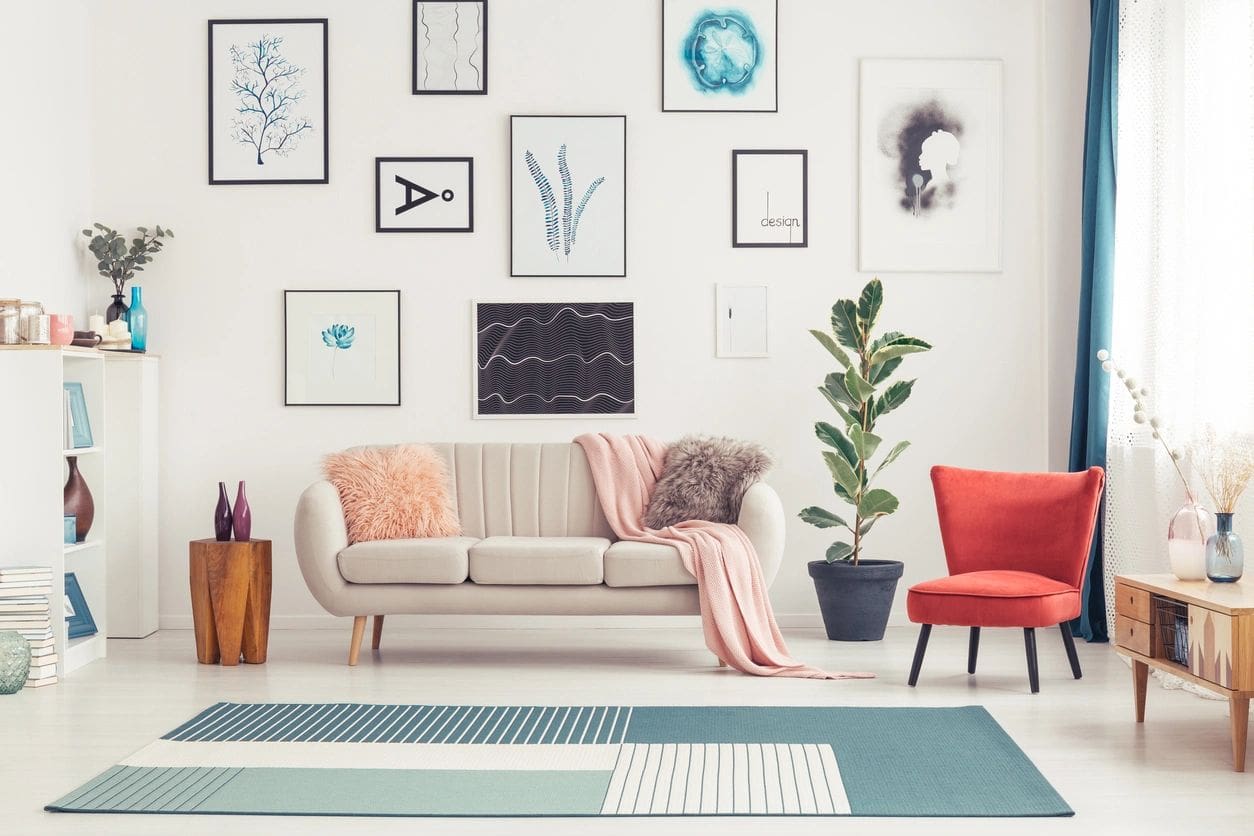 A living room with many pictures on the wall