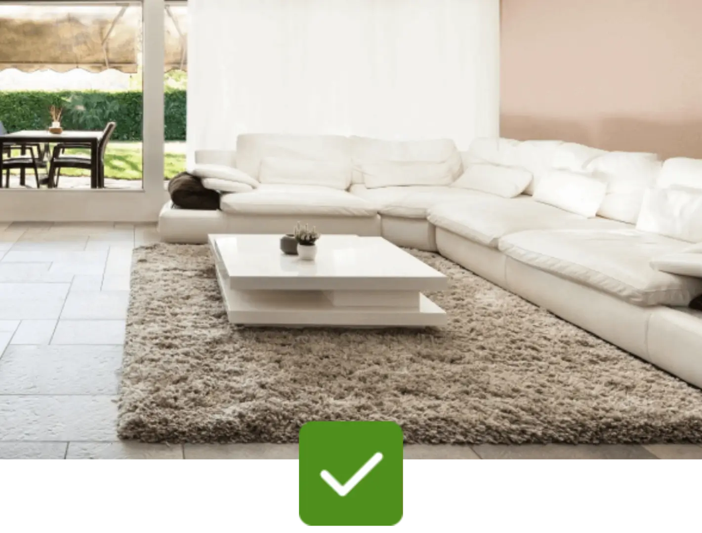 a neat and clean white color sofa with a checkmark